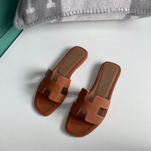 HERM Oran Slide Sandals In Gold Clemence Leather