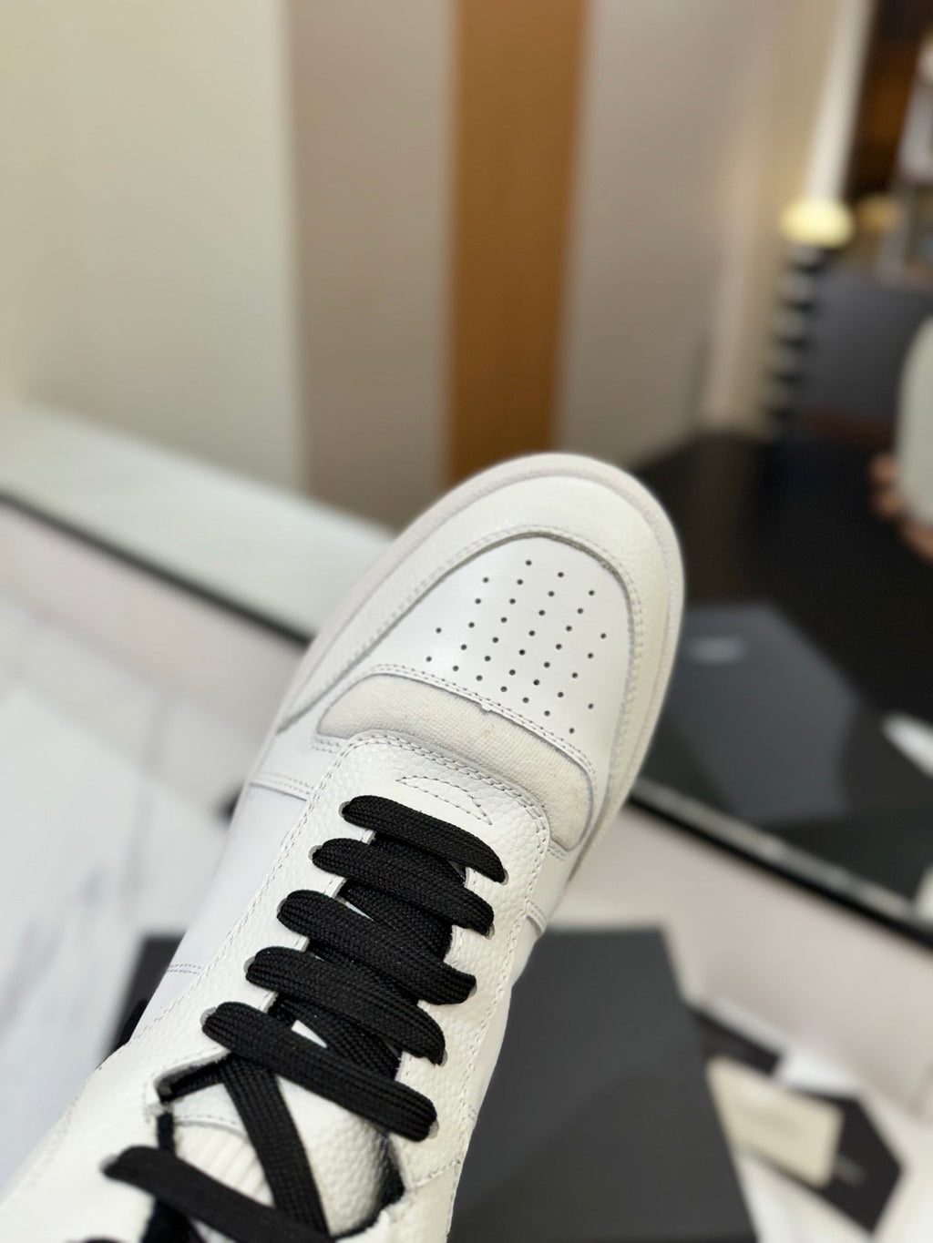 MID-TOP SNEAKERS IN WHITE AND BLACK TRIM PERFORATED LAMBSKIN